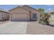 Charming home featuring a two-car garage and a xeriscaped front yard at 8733 W Laurel Ln, Peoria, AZ 85345