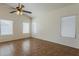 Bright living room featuring tile flooring, three windows and neutral paint at 8733 W Laurel Ln, Peoria, AZ 85345