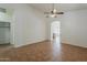 Bright living room with neutral paint, tile flooring, and a ceiling fan at 8733 W Laurel Ln, Peoria, AZ 85345