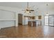 Open-concept kitchen and living space with tile floors and natural light at 8733 W Laurel Ln, Peoria, AZ 85345