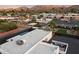 Expansive aerial view of home with mountain backdrop and neighborhood pool at 10245 N 34Th Pl, Phoenix, AZ 85028