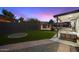 Inviting backyard with seating area and synthetic grass, perfect for outdoor entertaining at 10245 N 34Th Pl, Phoenix, AZ 85028
