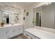 Bright bathroom with double vanity, large mirrors, and stylish lighting at 10245 N 34Th Pl, Phoenix, AZ 85028