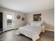 Comfortable bedroom featuring tile floors and a door to the pool area at 10245 N 34Th Pl, Phoenix, AZ 85028