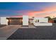Charming single-story home featuring a modern garage, neutral paint, and desert landscaping for low maintenance at 10245 N 34Th Pl, Phoenix, AZ 85028