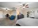 Comfortable main bedroom with neutral colors features a ceiling fan, closet, and an attached office area at 10245 N 34Th Pl, Phoenix, AZ 85028