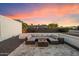 Enjoy outdoor living on this patio with comfortable seating and a cozy fire pit perfect for relaxing evenings at 10245 N 34Th Pl, Phoenix, AZ 85028