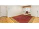 Open bonus room with wood floors, a large window, and a chair at 1445 W Wood Dr, Phoenix, AZ 85029