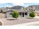 Charming single-story home with a well-maintained front yard and desert landscaping at 1445 W Wood Dr, Phoenix, AZ 85029