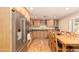 Spacious kitchen with wood cabinets, granite countertops, and stainless steel appliances at 1445 W Wood Dr, Phoenix, AZ 85029