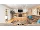 Cozy living room with a fireplace, tiled feature wall, and a large sliding glass door at 1445 W Wood Dr, Phoenix, AZ 85029