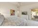 Primary bedroom featuring neutral carpet, white walls, and a sliding glass door at 15695 W Earll Dr, Goodyear, AZ 85395