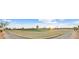 Panoramic view of the golf course community featuring lush green grass and manicured landscaping at 15695 W Earll Dr, Goodyear, AZ 85395