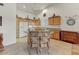 Open kitchen with wood cabinets, a center island, and stainless steel appliances at 15695 W Earll Dr, Goodyear, AZ 85395