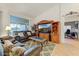 Open living space with large windows and neutral tile floors at 15695 W Earll Dr, Goodyear, AZ 85395