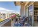 Charming balcony seating area with flowers and city views at 15802 N 71St St # 657, Scottsdale, AZ 85254