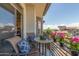 Inviting balcony with seating and flowers overlooking the neighborhood at 15802 N 71St St # 657, Scottsdale, AZ 85254