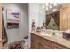 Elegant bathroom features a granite countertop vanity and decorative towels at 15802 N 71St St # 657, Scottsdale, AZ 85254