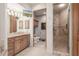 Bathroom featuring double sinks and a walk-in shower at 15802 N 71St St # 657, Scottsdale, AZ 85254