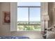 Bedroom view of landscape with window shutters and a telescope in foreground at 15802 N 71St St # 657, Scottsdale, AZ 85254