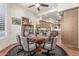 Large dining room featuring wood floors, plantation shutters and views into the kitchen at 15802 N 71St St # 657, Scottsdale, AZ 85254