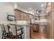 Open kitchen with wood cabinets, granite counters, stainless appliances and an island is perfect for entertaining at 15802 N 71St St # 657, Scottsdale, AZ 85254