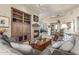 Cozy living room with a fireplace, built-in bookshelves, and comfortable seating at 15802 N 71St St # 657, Scottsdale, AZ 85254