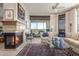 Bright living room features a fireplace, balcony access, and comfortable seating at 15802 N 71St St # 657, Scottsdale, AZ 85254