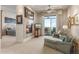 Open living room with fireplace and access to covered balcony offers beautiful mountain views at 15802 N 71St St # 657, Scottsdale, AZ 85254