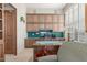 Spacious office with custom shelving, large window, and comfortable seating at 15802 N 71St St # 657, Scottsdale, AZ 85254