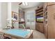 Well-appointed office space with built-in shelving, TV, and classic furnishings at 15802 N 71St St # 657, Scottsdale, AZ 85254
