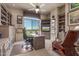 Large office with built-in shelves, a ceiling fan, and a great view at 15802 N 71St St # 657, Scottsdale, AZ 85254