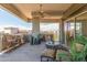 Relaxing covered patio with comfortable seating and ceiling fan at 15802 N 71St St # 657, Scottsdale, AZ 85254