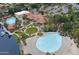 Stunning aerial view of the resort-style community featuring multiple pools, and lush landscaping at 1633 E Lakeside Dr # 143, Gilbert, AZ 85234