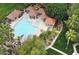 Aerial view of the community pool and spa surrounded by lush landscaping and covered seating areas at 1633 E Lakeside Dr # 143, Gilbert, AZ 85234