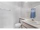 Well-lit bathroom featuring a large mirror, vanity sink, and shower/tub combo with blue accents at 1633 E Lakeside Dr # 143, Gilbert, AZ 85234