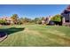 Community green space and walking paths lined with attractive homes and mature trees, perfect for enjoying the outdoors at 1633 E Lakeside Dr # 143, Gilbert, AZ 85234