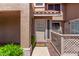 Home entrance features a neutral door, stone pathway, and privacy railing at 1633 E Lakeside Dr # 143, Gilbert, AZ 85234
