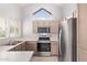 Well-lit kitchen featuring modern appliances, ample counter space, and a bright window view at 1633 E Lakeside Dr # 143, Gilbert, AZ 85234