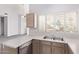 Kitchen showcases a stainless steel dishwasher and views to the living room at 1633 E Lakeside Dr # 143, Gilbert, AZ 85234