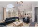 Bright living room with vaulted ceiling, fireplace, and sliding glass door to the balcony at 1633 E Lakeside Dr # 143, Gilbert, AZ 85234