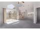 Open-concept living room boasts vaulted ceilings, and a sliding glass door at 1633 E Lakeside Dr # 143, Gilbert, AZ 85234