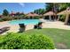 Well-maintained community pool area featuring lounge chairs, cabanas, and lush landscaping, providing a resort-like experience at 1633 E Lakeside Dr # 143, Gilbert, AZ 85234