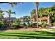 Inviting community pool with lounge chairs, surrounded by lush greenery, providing a relaxing recreational space at 1633 E Lakeside Dr # 143, Gilbert, AZ 85234