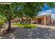 Spacious backyard featuring a play structure, patio, and desert landscaping at 16837 W Northampton Rd, Surprise, AZ 85374