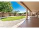 Inviting low maintenance backyard with an extended covered patio, perfect for relaxing and enjoying the outdoors at 16837 W Northampton Rd, Surprise, AZ 85374