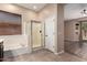 Bathroom with tiled floors, and a combined tub and shower combo with glass doors at 16837 W Northampton Rd, Surprise, AZ 85374