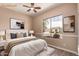 Bright bedroom with large window overlooking the landscaped yard and contemporary decor at 16837 W Northampton Rd, Surprise, AZ 85374