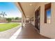 Spacious covered patio with a stained concrete floor leading to a low maintenance backyard at 16837 W Northampton Rd, Surprise, AZ 85374