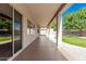 Spacious covered patio with access to a low maintenance backyard, perfect for outdoor living and entertaining at 16837 W Northampton Rd, Surprise, AZ 85374